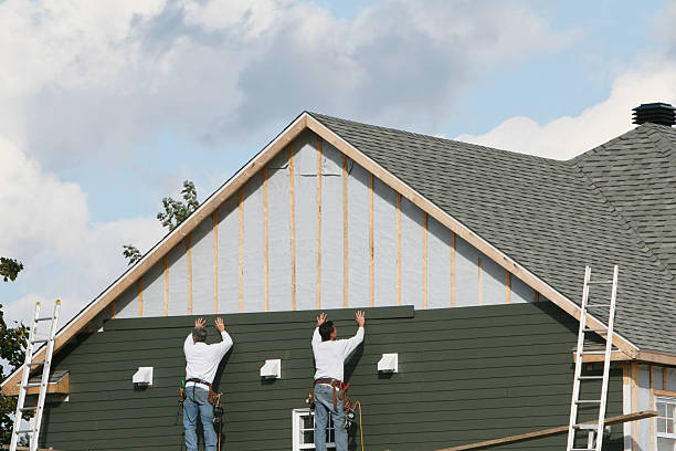 Professional Siding Contractor technician working in Russells Point, OH